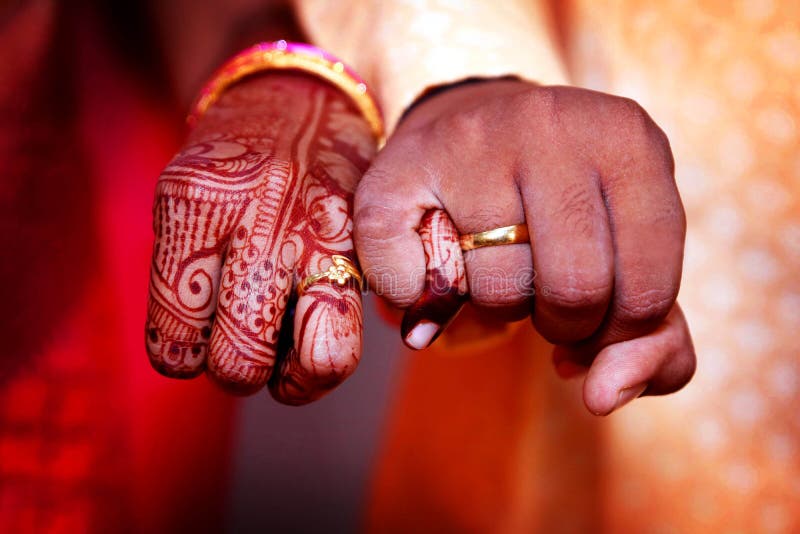 Engagement Ring Ceremony Indian Hindu Male Putting Ring On Brides Decorated  Finger Couple Is Well Attired As Per Traditional Indian Hindu Wedding Groom  Wearing Jodhpuri Suit And Floral Garland Stock Photo -