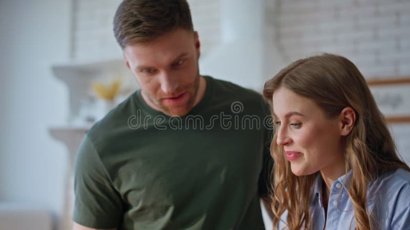 Couple hands holding tea using laptop morning kitchen closeup. Spouses talking stock video