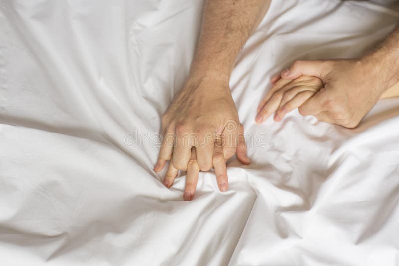 Couple Hands Pulling White Sheets In Ecstasy Orgasm Concept Of Passion Orgasm Erotic Moments