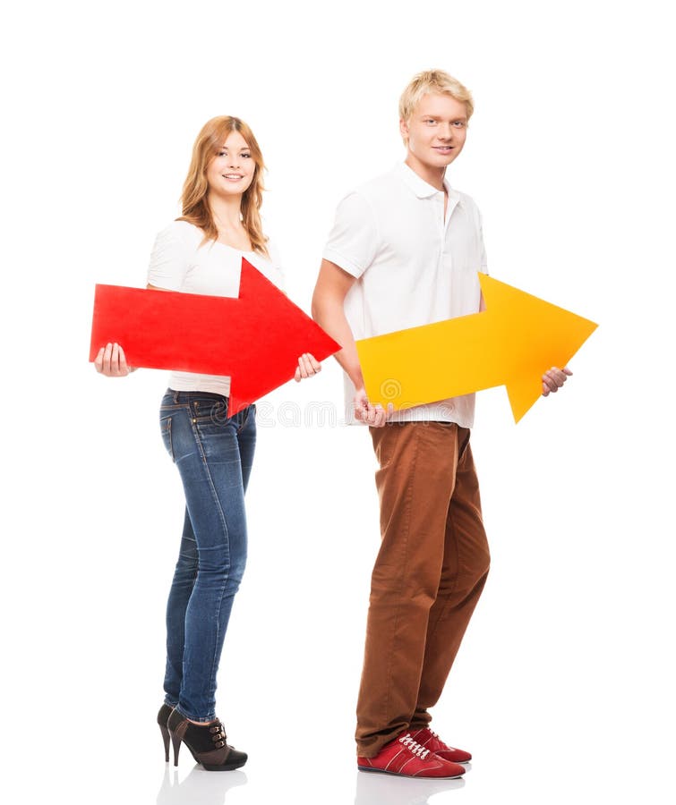 A couple of happy teenagers holding colorful arrows