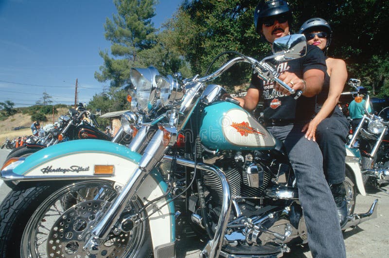 A couple on a Harley Davidson motorcycle, Malibu, CA