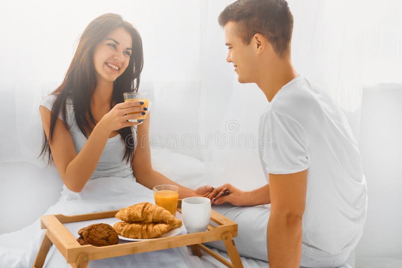 Couple Having Breakfast In Bed Stock Photo - Image of adult, couple ...