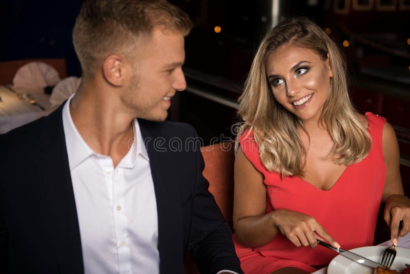 Couple Having Dinner in a Restaurant Eating Food Stock Image - Image of ...