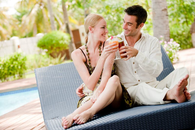 Couple Having Drinks stock photo. Image of relaxed, pool 8904190