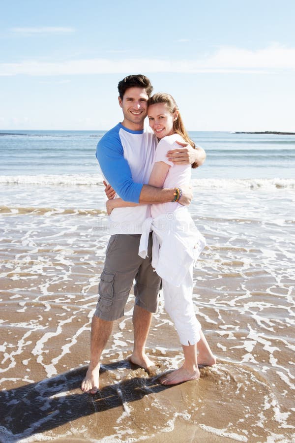 Couple Having Fun On Beach Holiday royalty free stock image