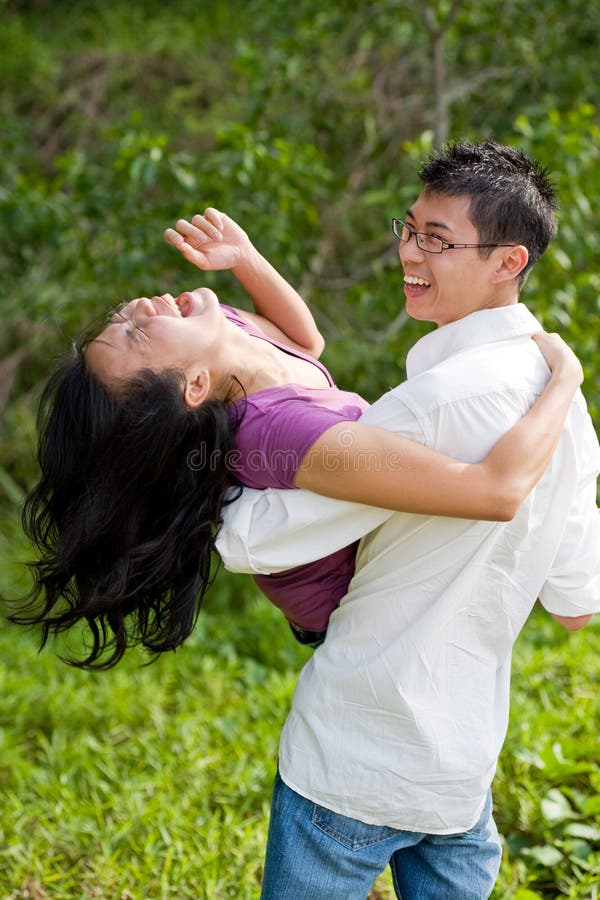 Couple having fun in the tropical garden