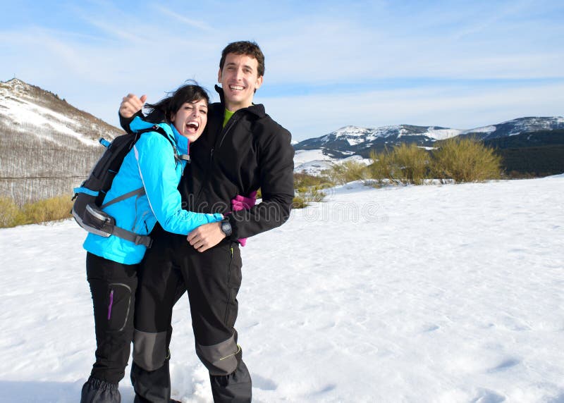 Couple having fun on winter hiking trip royalty free stock photo Couple having fun on winter hiking trip royalty free stock photo