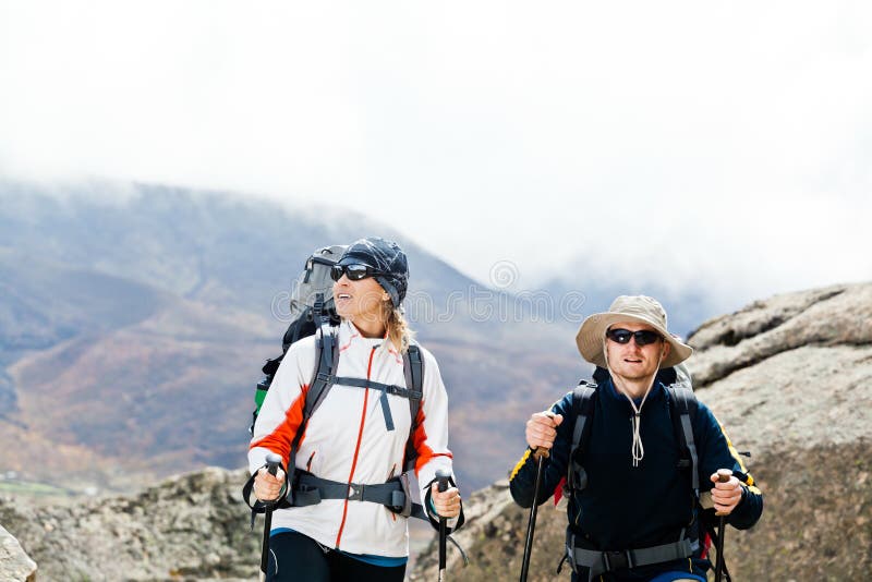 Couple hiking in mountains stock image