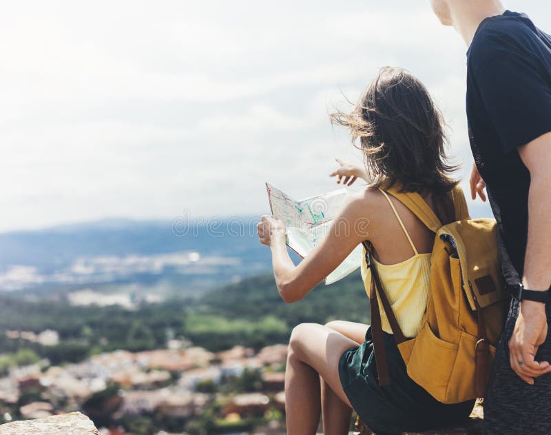 Couple hipster tourist hold and look map on trip, lifestyle concept adventure together, traveler with backpack on background mount stock images Couple hipster tourist hold and look map on trip, lifestyle concept adventure together, traveler with backpack on background mount stock images