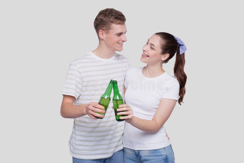 Couple Holding Beer Bottle Looking At Each Otherisolated Couple Standing And Holding Beer