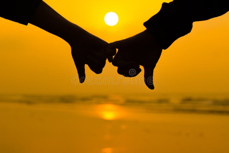 Couple Holding Each Other Hands Using Little Pinky Finger in Background of  Sunrise at the Beach Stock Image - Image of couple, hand: 116354787