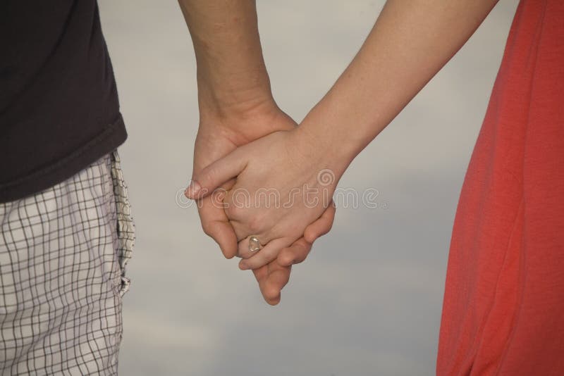 Couple holding hands