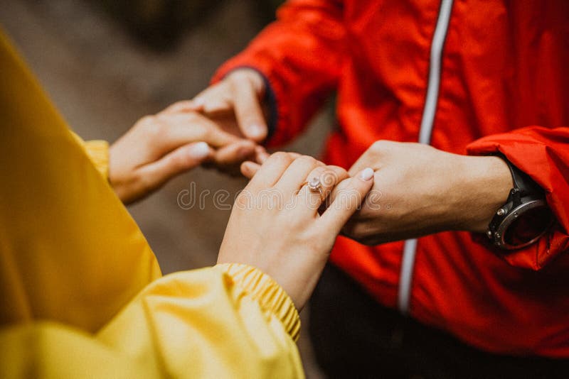 Couple Holding Hands. Hand with Engagement Ring. Couple in Love. Love