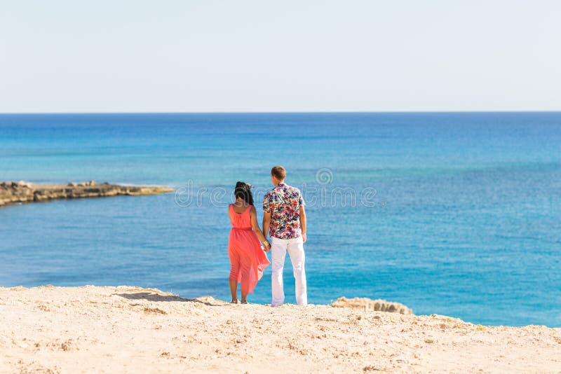 Couple Holding Hands Walking Away. Outside, beautiful.