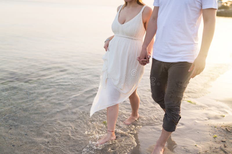 Couple holding hands walking romantic on beach on vacation travel holidays stock images Couple holding hands walking romantic on beach on vacation travel holidays stock images