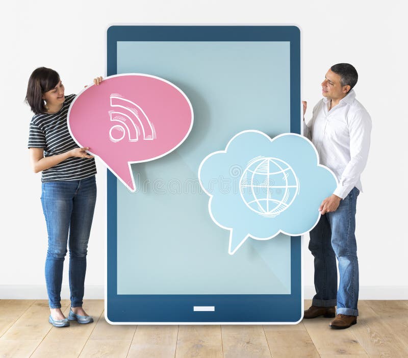 Diverse people holding speech bubbles and tabletCouple holding speech bubbles and tablet stock photography
