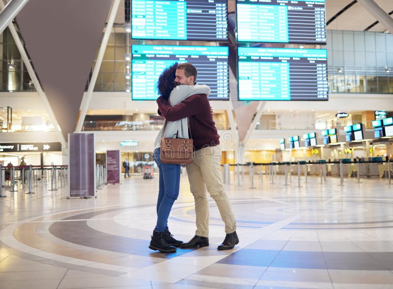 Couple, hug and goodbye at airport for travel, trip or flight in farewell for long distance relationship. Man and woman