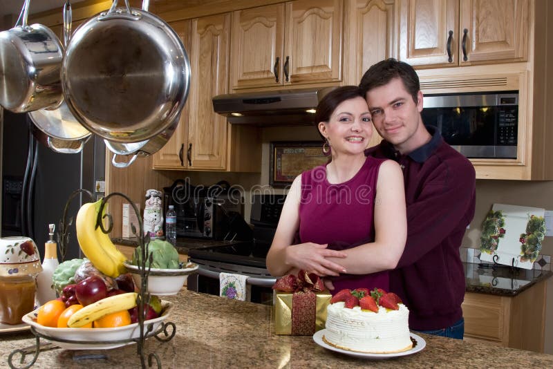 Couple Hugging in the Kitchen - Horizontal