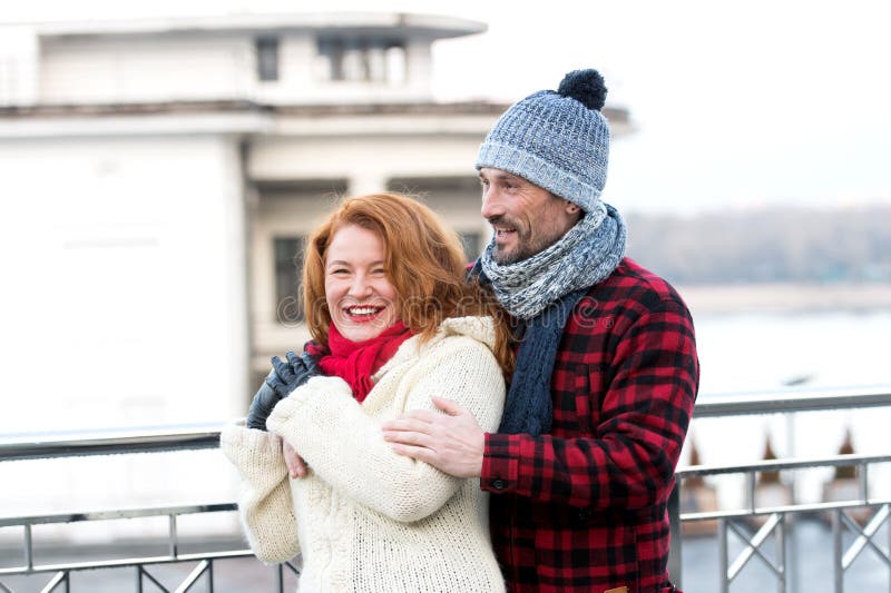 Couple hugs on street. Man hugging woman. Urban couple date. Happy man hugs woman. Smiling woman with man on street. stock photo Couple hugs on street. Man hugging woman. Urban couple date. Happy man hugs woman. Smiling woman with man on street. stock photo