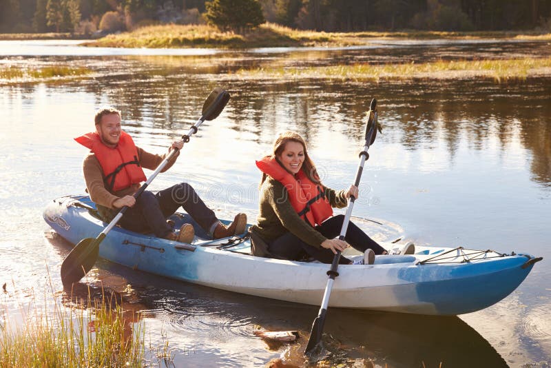 Couple kayaking on lake, front view, Big Bear, California royalty free stock image