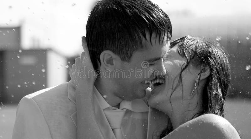 Couple kissing in rain