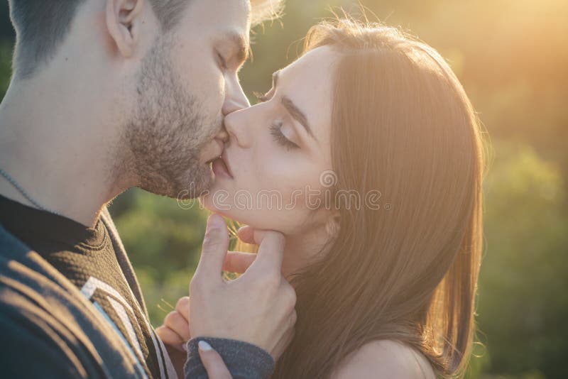 Couple kissing. Touching face ecstasy and pleasure. Making kiss to young lover. Sensual couple make kiss. Young lovers stock photo Couple kissing. Touching face ecstasy and pleasure. Making kiss to young lover. Sensual couple make kiss. Young lovers stock photo