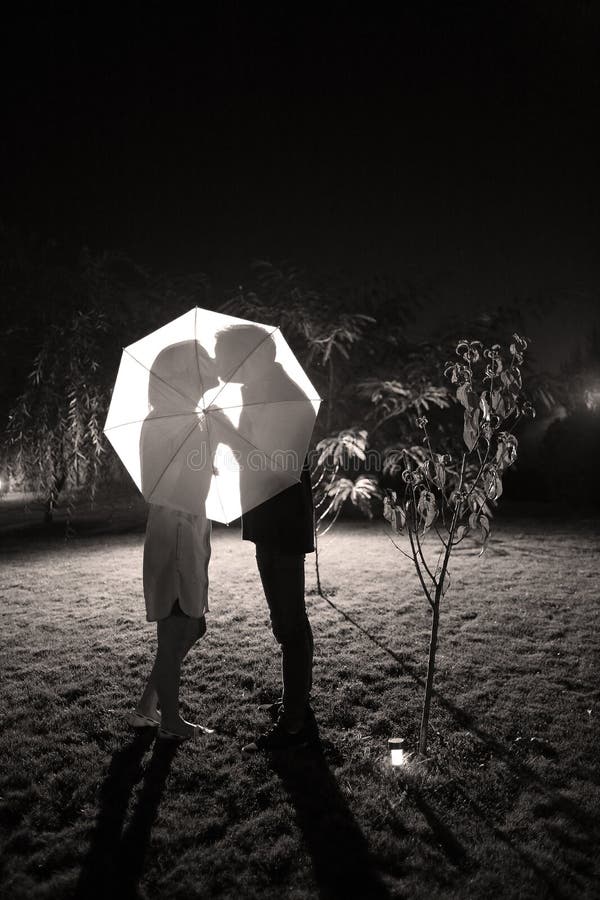 Couple kissing under the umbrella