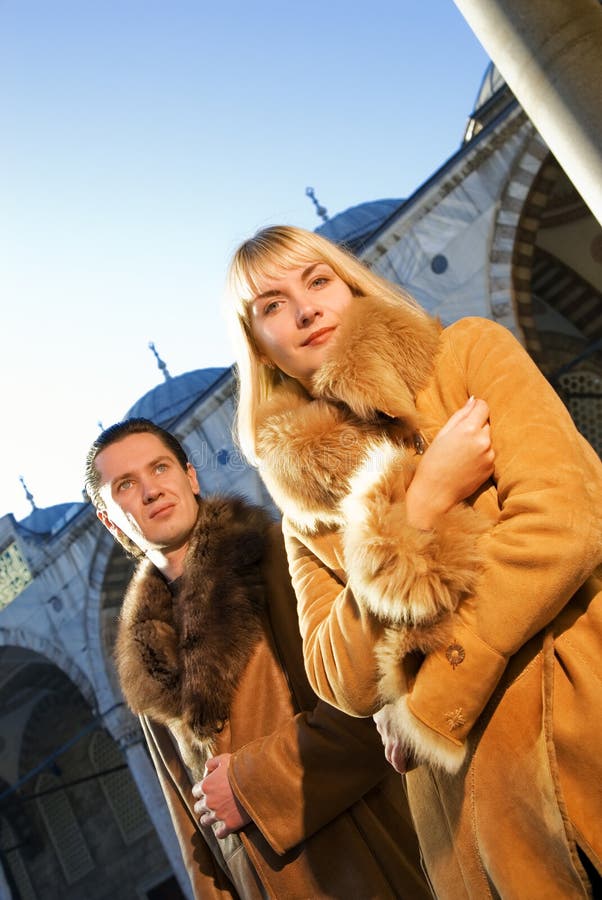 Couple in lambskin coats