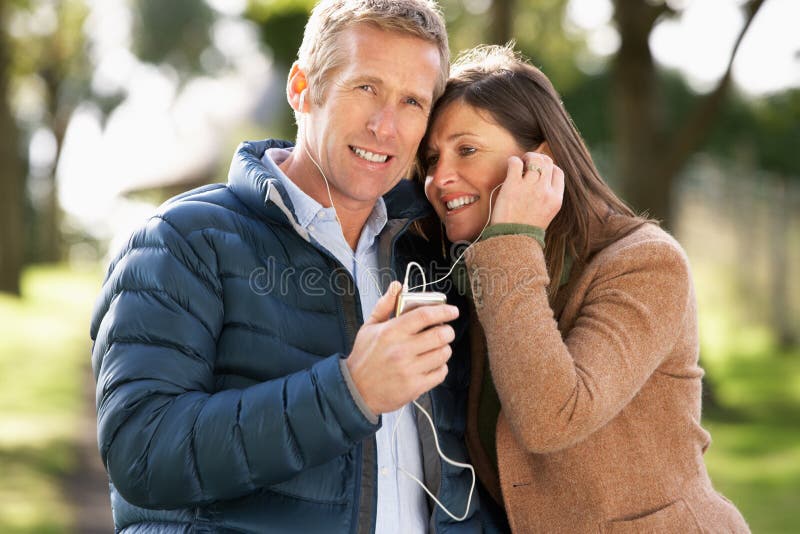Couple Listening To MP3 Whilst Walking
