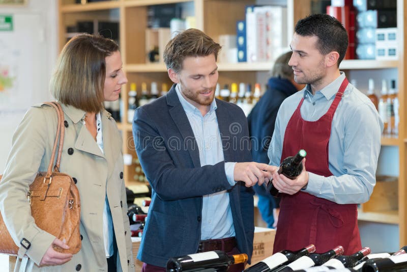 Couple Looking for Good Wine Stock Photo Image of selecting