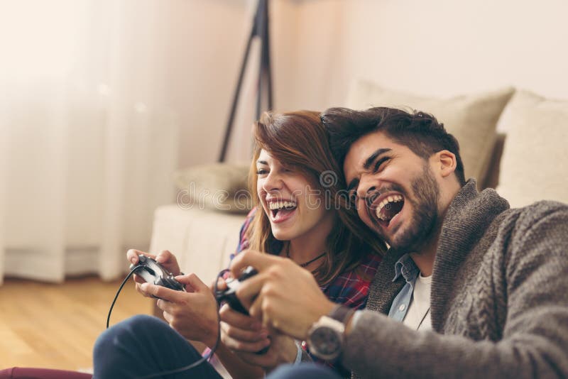 Couple playing games stock image. Image of girlfriend - 132760653