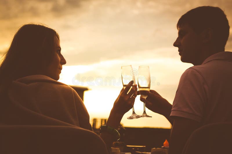 couple love glasses wine romance roof sunset