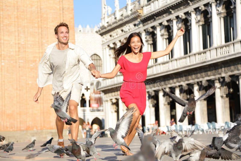 Couple in love having playful fun in Venice stock photos Couple in love having playful fun in Venice stock photos