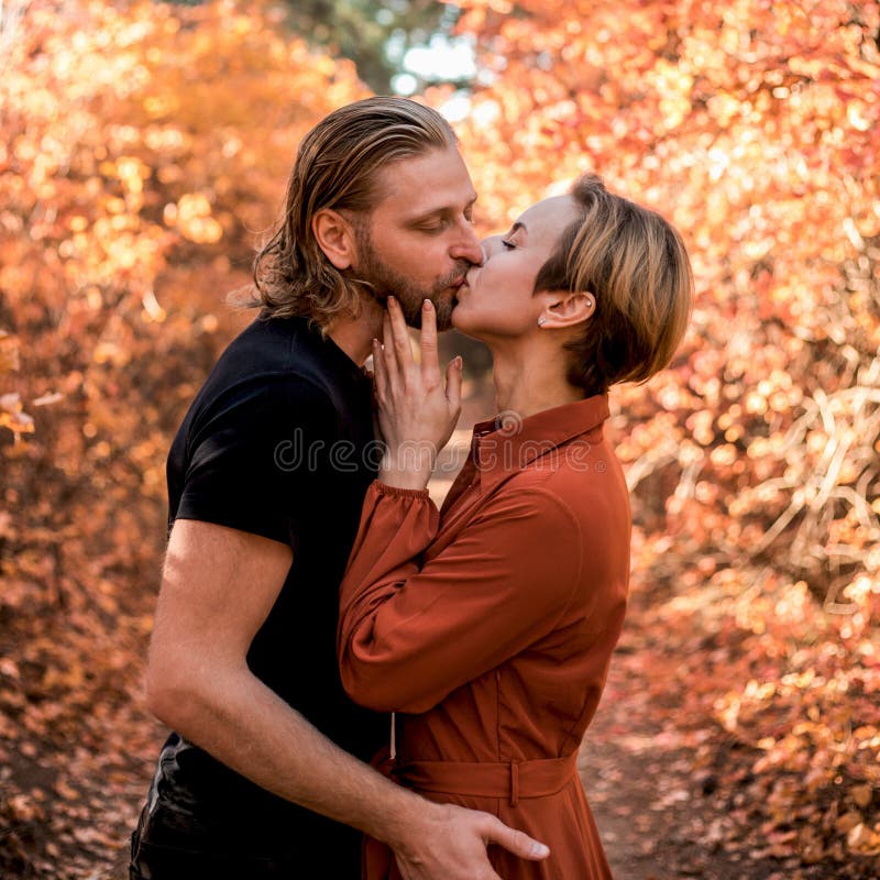 Couple in love kissing in the forest royalty free stock photos Couple in love kissing in the forest royalty free stock photos