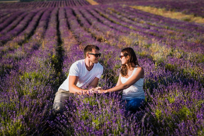 Couple in love on lavender fields. Boy and girl in the flower fields