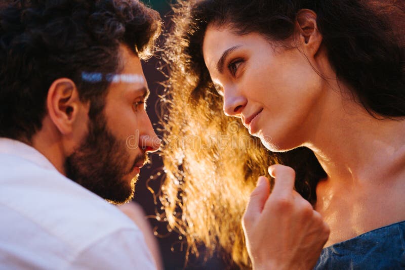A Beautiful Affection Scan Couple in Love, Looking at Each Other with Sexual Passion and Affection