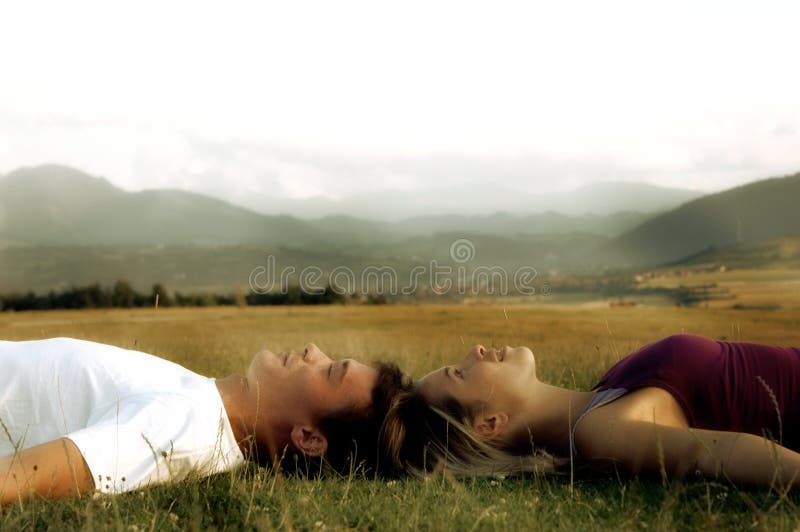 Couple lying on the grass