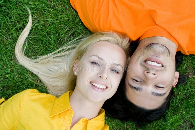 Couple lying on grass