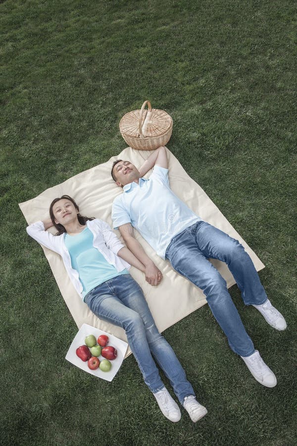 Couple Lying on Picnic Blanket. Stock Image Image of chinese, idyllic 33398637