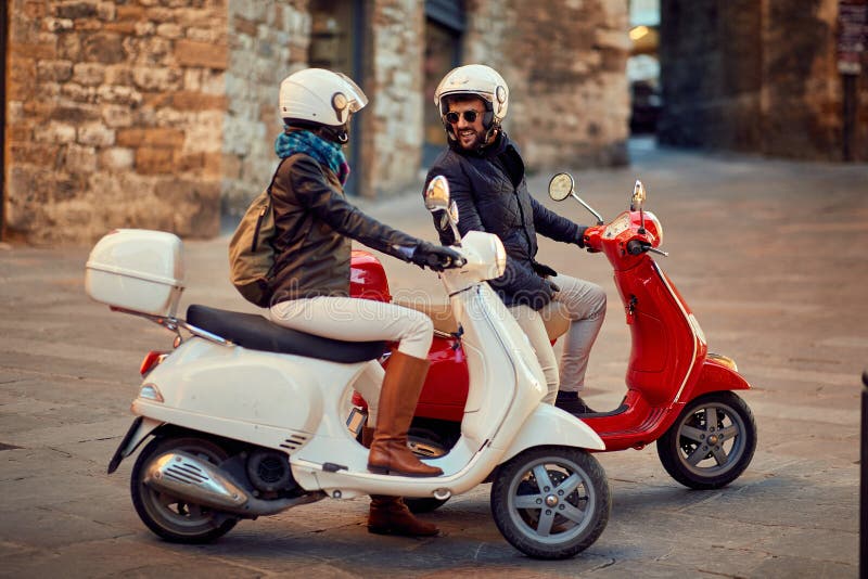 Couple on Motor Scooter. Bikers on the Road Stock Image - Image of ...