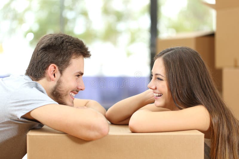 Couple moving house looking each other