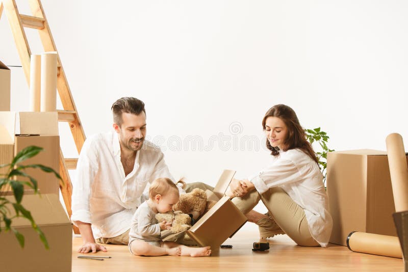 Couple moving to a new home - Happy married people buy a new apartment to start new life together stock images Couple moving to a new home - Happy married people buy a new apartment to start new life together stock images