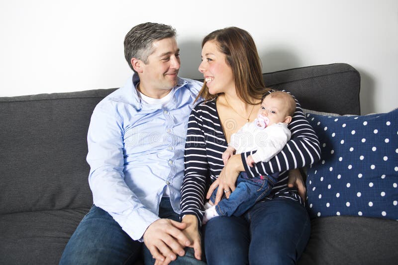 Couple with new baby at home royalty free stock images Couple with new baby at home royalty free stock images