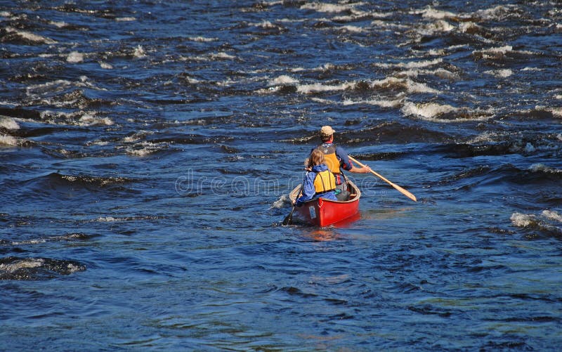 Couple Paddling Canoe on River Stock Image Image of choppy