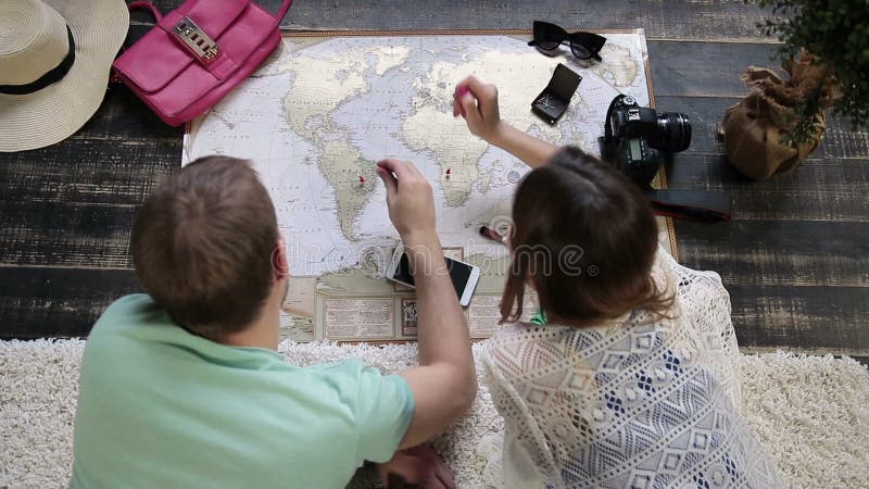 Couple planning new journey with travel map