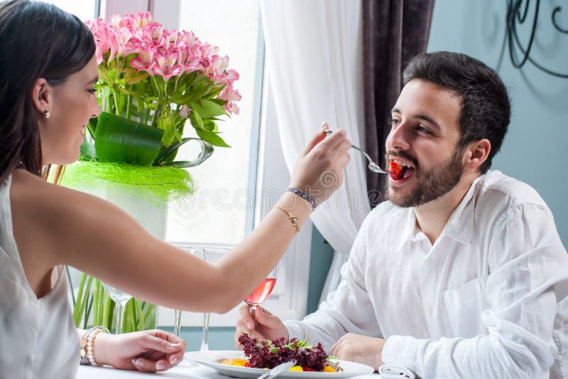 girl feeding boy