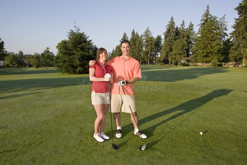 Couple Playing Golf on Course - Horizontal