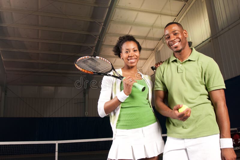Couple playing tennis stock photos