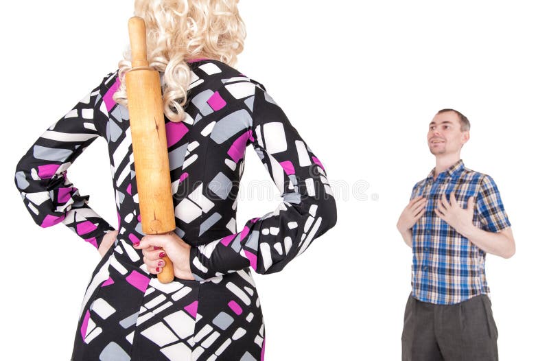 Couple Problem. Stereotypical Wife With Rolling Pin And Her Husband