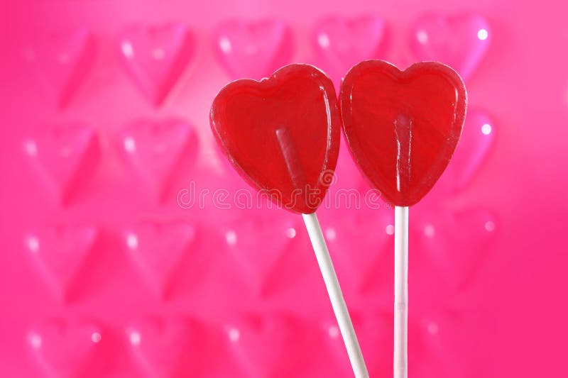 Couple of red heart shape lollipops in love concept royalty free stock photos Couple of red heart shape lollipops in love concept royalty free stock photos